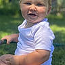 Bryce joined the competition — help win amazing prizes! baby, child, grass, outdoor, sunlight, smiling, onesie, blue_eyes, chubby_cheeks, sitting, greenery, car, daylight, cute, happy, infant, person, portrait, nature, summer