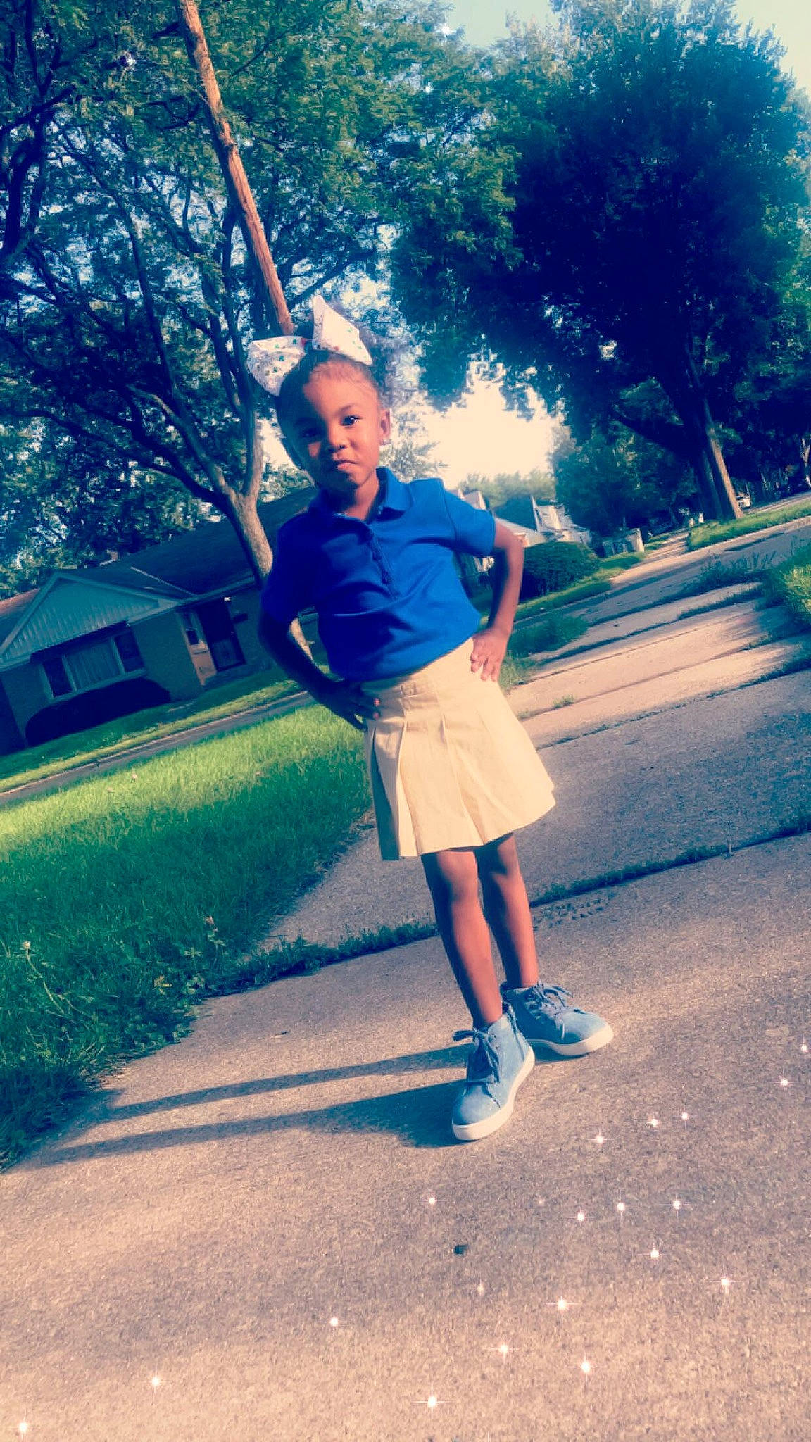 Laila is registered to the contest to win money with this photo: blue, child, clothing, day, fun, girl, grass, human_body, leg, person, photograph, photography, plant, recreation, shoulder, snapshot, standing, summer, sunlight, tree