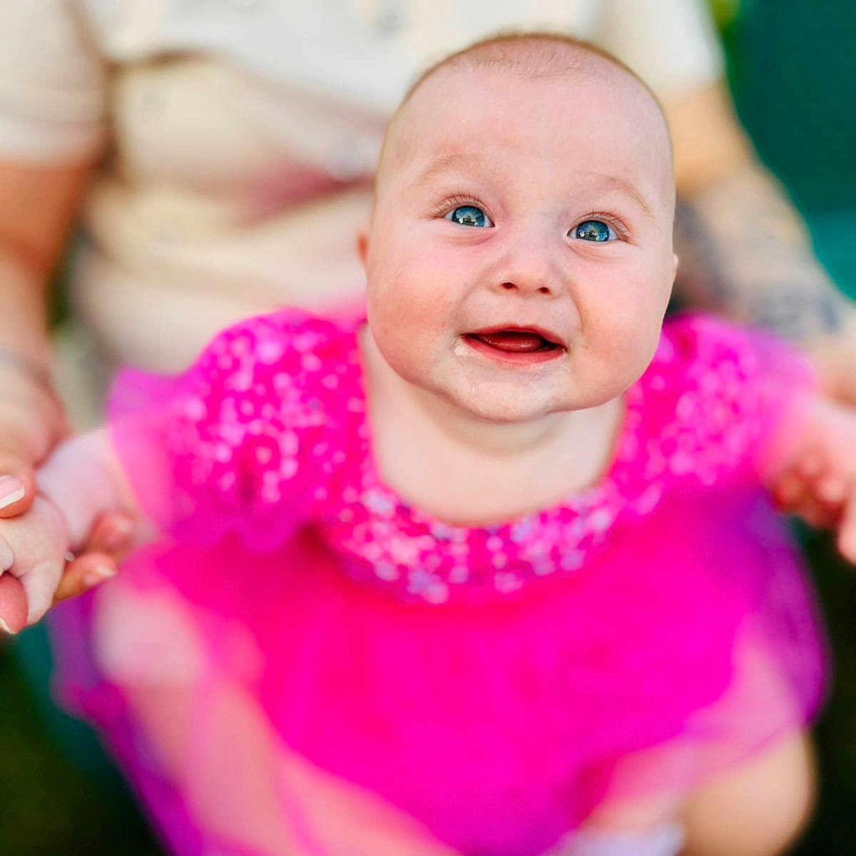 Eliya joined the competition — help win amazing prizes! baby, blue_eyes, blurred_background, child, closeup, clothing, cute, face, happy, head, holding_hands, infant, joyful, outdoor, person, pink_dress, portrait, rosy_cheeks, smiling, toddler