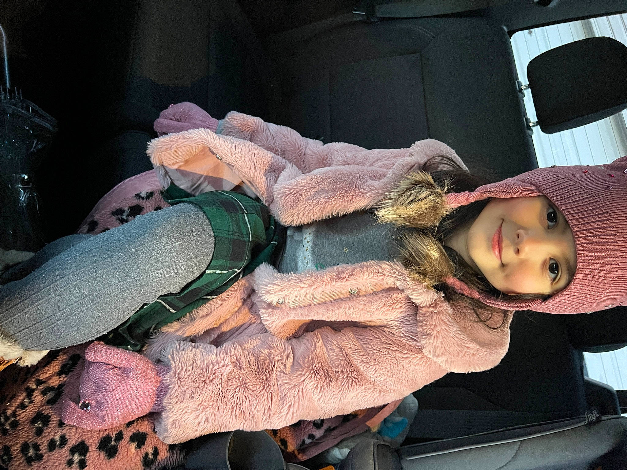 Thea joined the competition — help win amazing prizes! auto_part, automotive_lighting, car_seat, comfort, fun, fur, headwear, human_leg, joy, lap, luxury_vehicle, motor_vehicle, mouth, person, toddler, vehicle_door, wrist