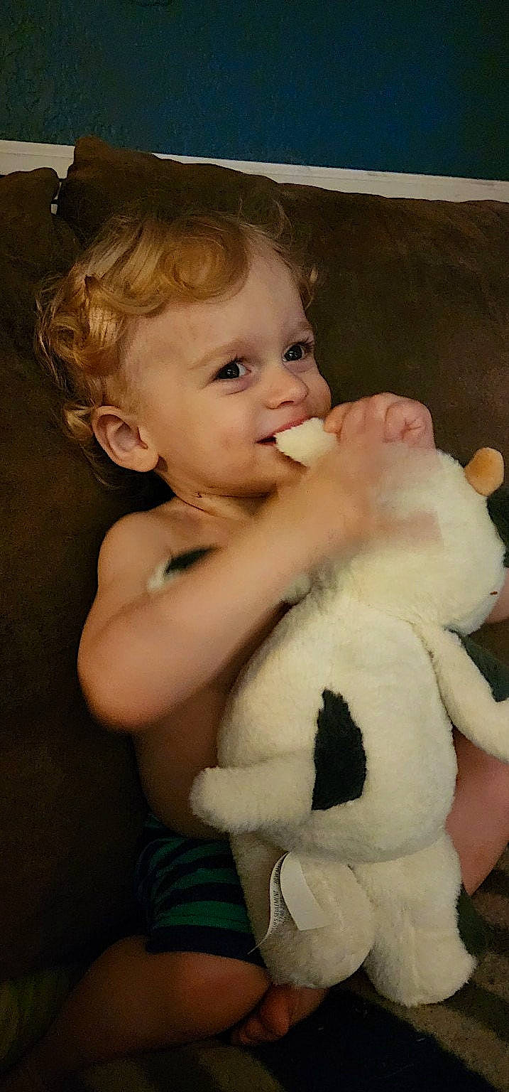 Kolten is registered to the contest to win money with this photo: arm, cheek, eye, facial_expression, finger, flash_photography, gesture, hairstyle, hand, happy, head, human_body, iris, lip, nose, person, skin, smile, standing, toddler