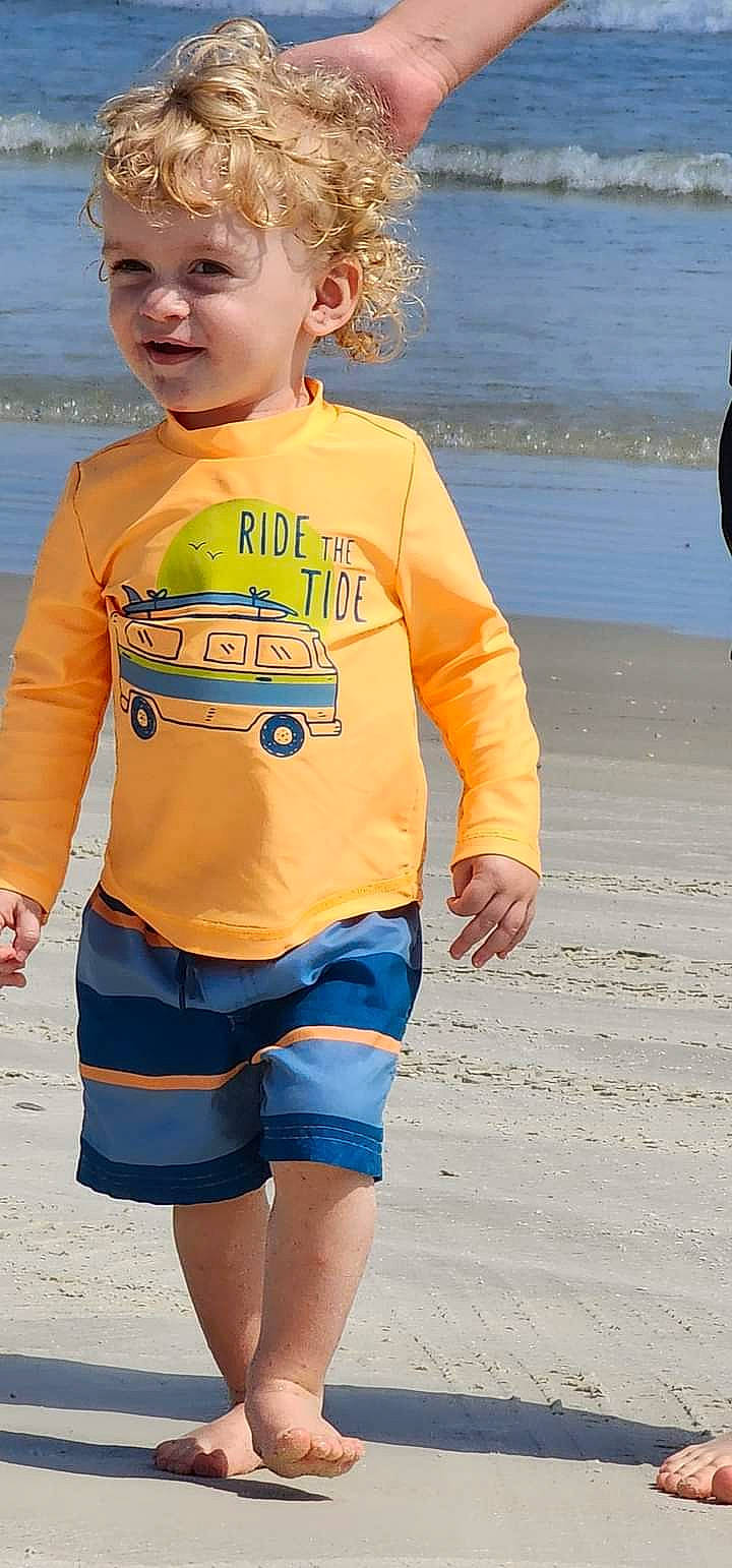 Kolten joined the competition — help win amazing prizes! baby_toddler_clothing, beach, cool, electric_blue, fashion, fun, happy, neck, orange, person, personal_protective_equipment, sand, sleeve, snapshot, summer, t_shirt, thigh, toddler, trunks, waist