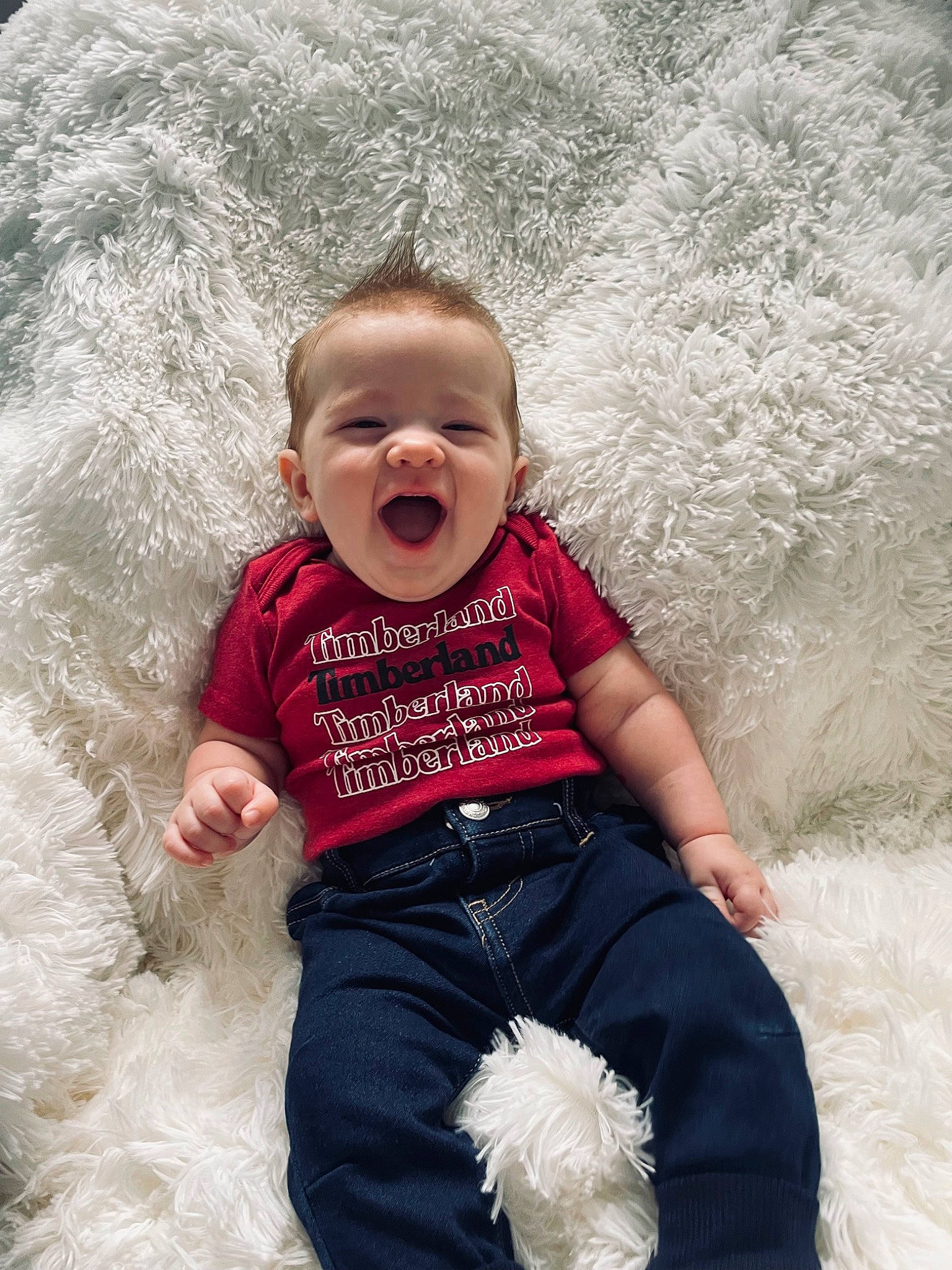 Wylder is registered to the contest to win money with this photo: baby, baby_toddler_clothing, child, eye, fun, grass, happy, head, landscape, leisure, people_in_nature, person, recreation, sitting, skin, smile, t_shirt, toddler, vacation, wave