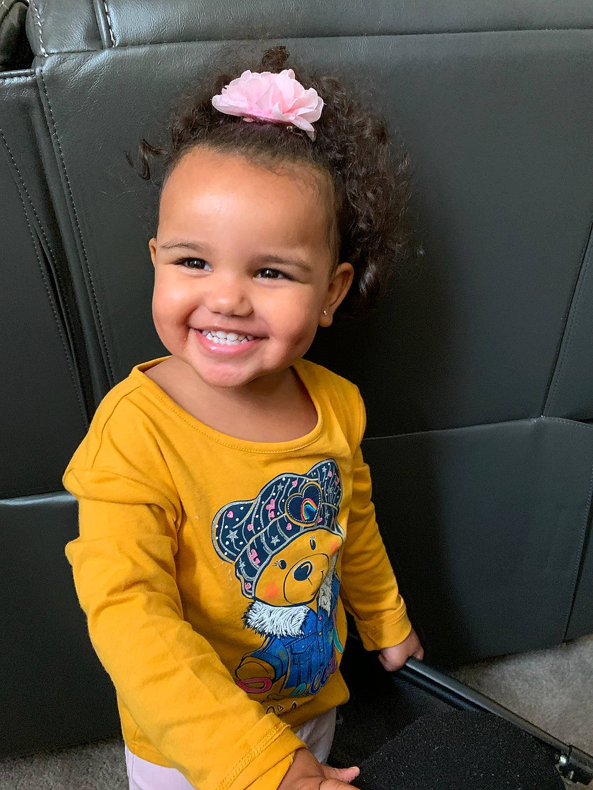 Kimber is registered to the contest to win money with this photo: automotive_design, baby_toddler_clothing, child, chin, cool, electric_blue, eye, face, flash_photography, fun, hairstyle, happy, iris, joy, person, skin, sleeve, smile, standing, t_shirt