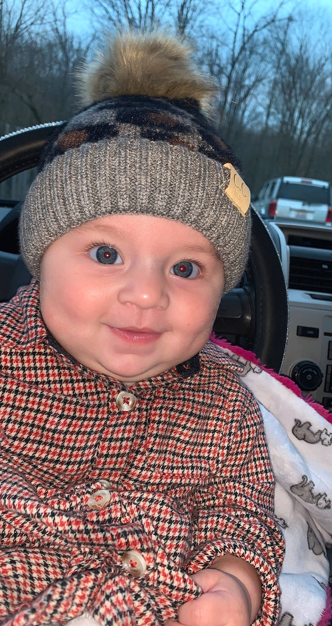 Sayge joined the competition — help win amazing prizes! automotive_tire, baby, cap, car, cheek, chin, cool, eye, eyebrow, face, fun, headgear, headwear, iris, joy, knit_cap, lip, nose, person, product