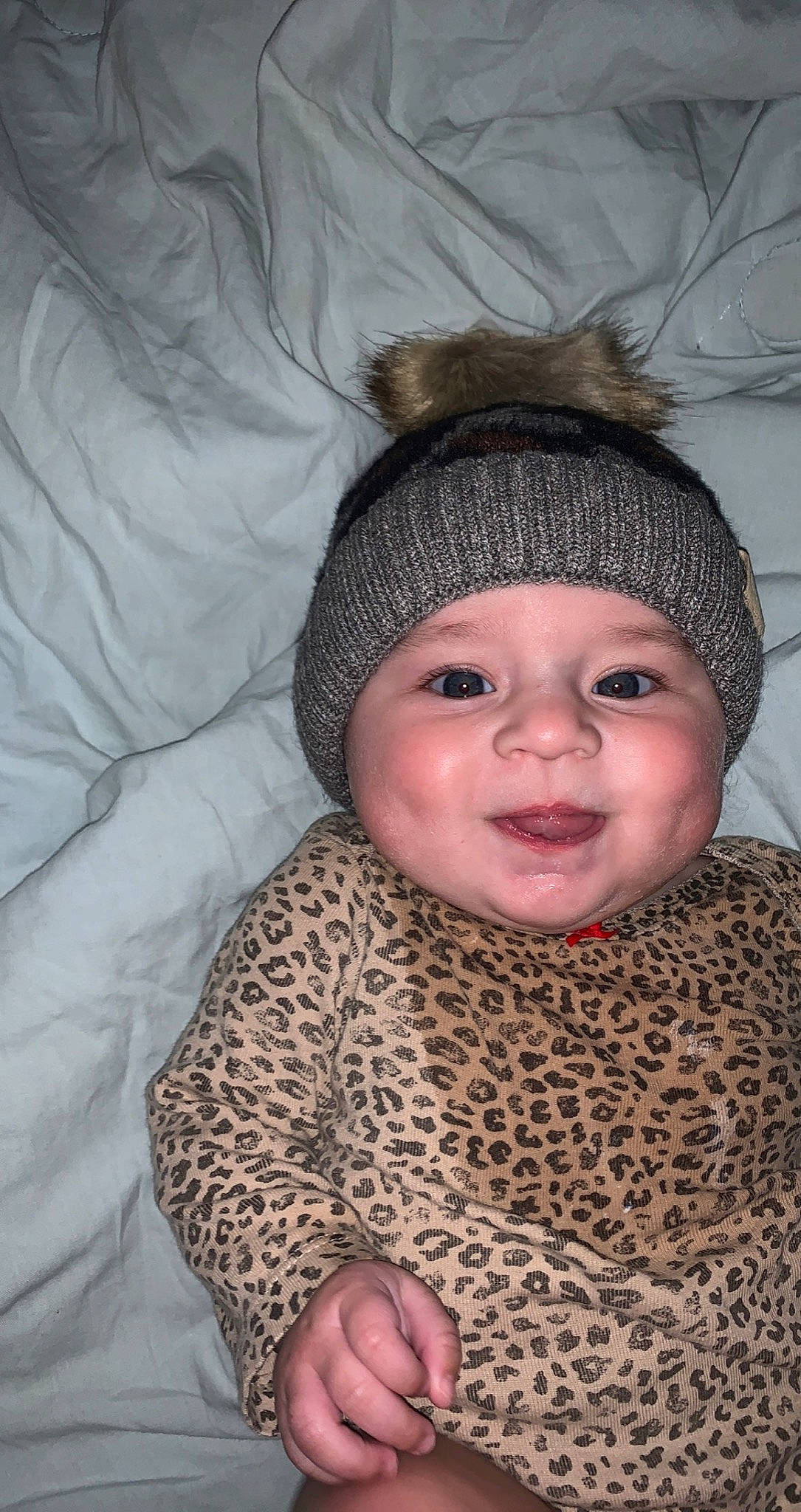 Sayge joined the competition — help win amazing prizes! baby_toddler_clothing, cap, cheek, comfort, eye, face, happy, head, headwear, iris, knit_cap, lip, nose, outerwear, person, skin, sleeve, smile, textile, toddler