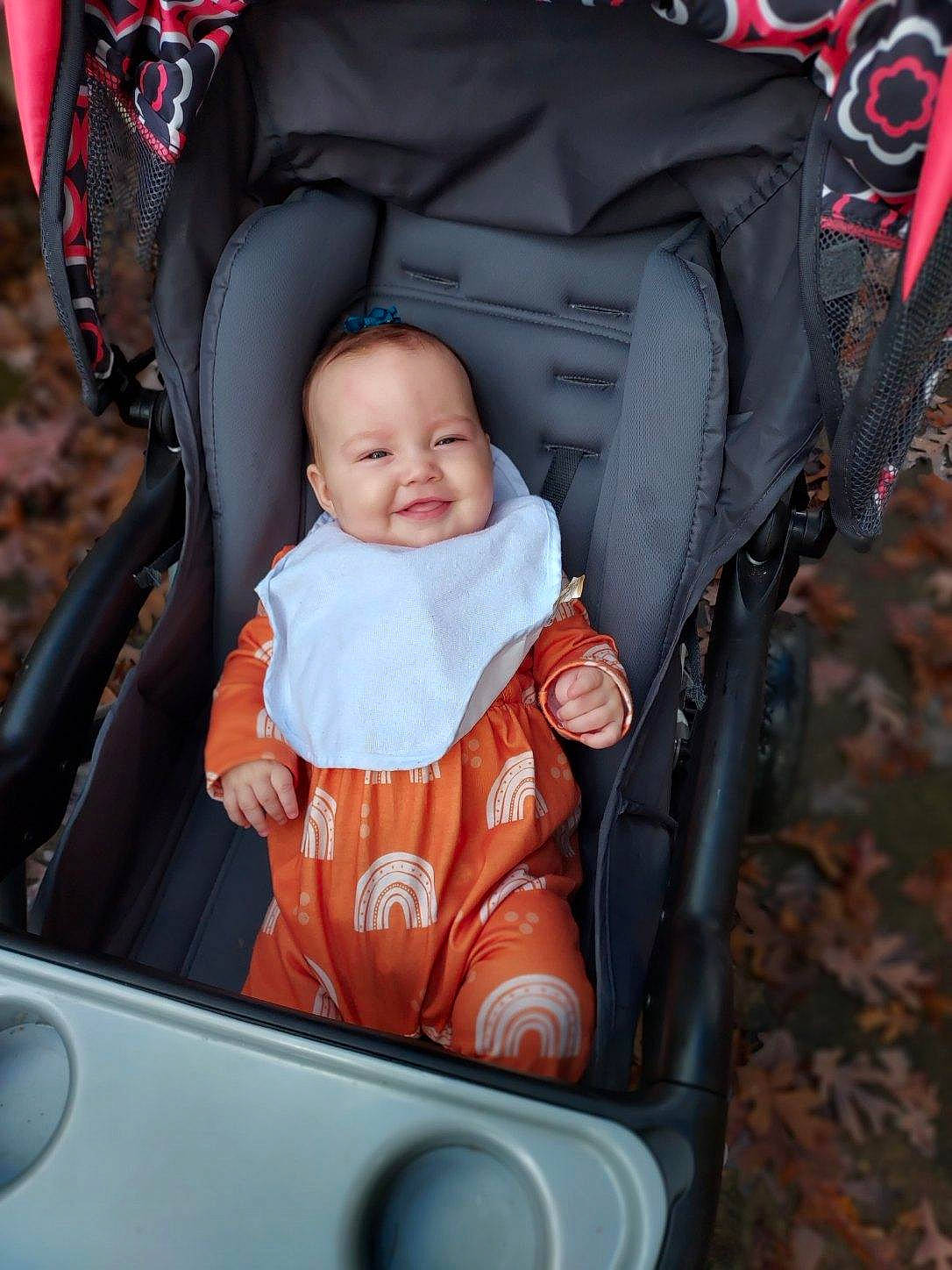 Ruby joined the competition — help win amazing prizes! auto_part, automotive_exterior, baby, baby_carriage, baby_products, baby_safety, baby_toddler_clothing, car_seat, child, comfort, eye, face, fun, joy, motor_vehicle, person, product, sitting, smile, toddler