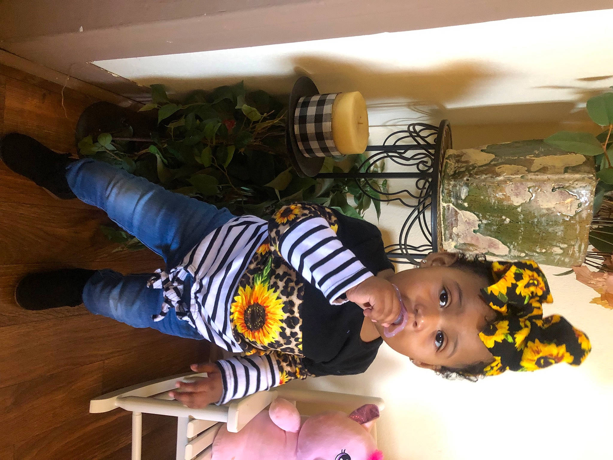 Nevaeh is registered to the contest to win money with this photo: baby, child, comfort, flooring, fun, happy, hardwood, houseplant, knee, laminate_flooring, leisure, person, plant, room, t_shirt, toddler, wood, wood_flooring