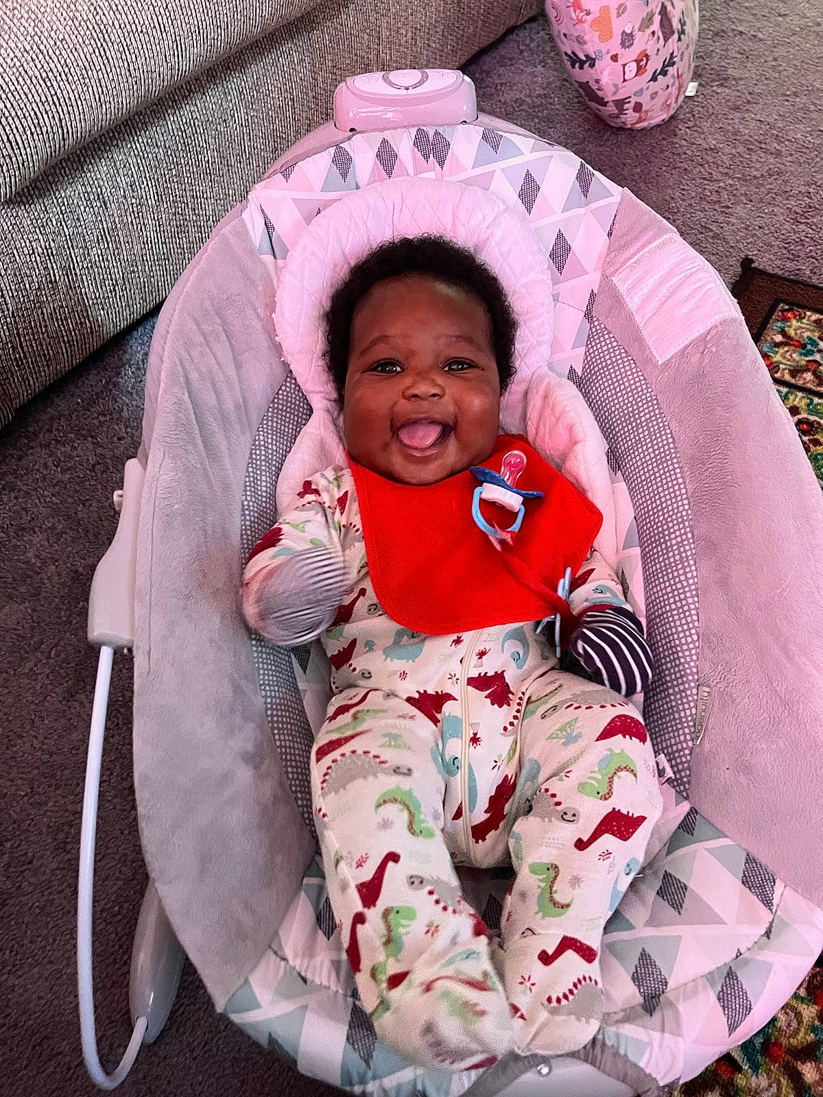 Kamari joined the competition — help win amazing prizes! baby, baby_toddler_clothing, child, comfort, face, fun, hairstyle, happy, head, lap, leisure, linens, magenta, person, pink, sitting, skin, sleeve, smile, textile