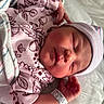 Renatta is registered to the contest to win money with this photo: baby, bed, blanket, clothing, cute, face, hand, hat, hospital, indoors, infant, newborn, pattern, peaceful, person, rest, skin, sleeping, soft, wristband