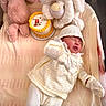 Renatta is registered to the contest to win money with this photo: baby, blanket, bunny, cake, cozy, cute, decorated_cake, hat, indoors, infant, knitwear, mittens, newborn, plush_toy, portrait, resting, sleeping, soft_texture, stuffed_animal, white_clothing