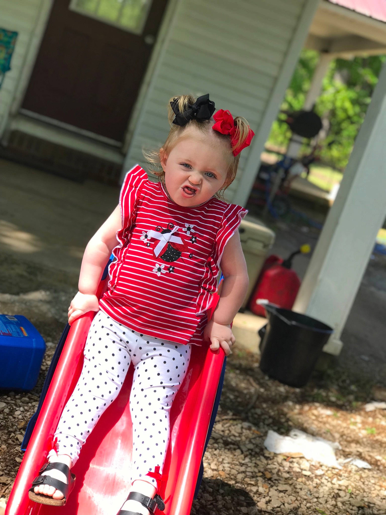 Raelynn joined the competition — help win amazing prizes! baby, child, child_model, design, fun, leisure, outdoor_play_equipment, pattern, person, play, playground, playground_slide, polka_dot, public_space, red, smile, toddler, vacation