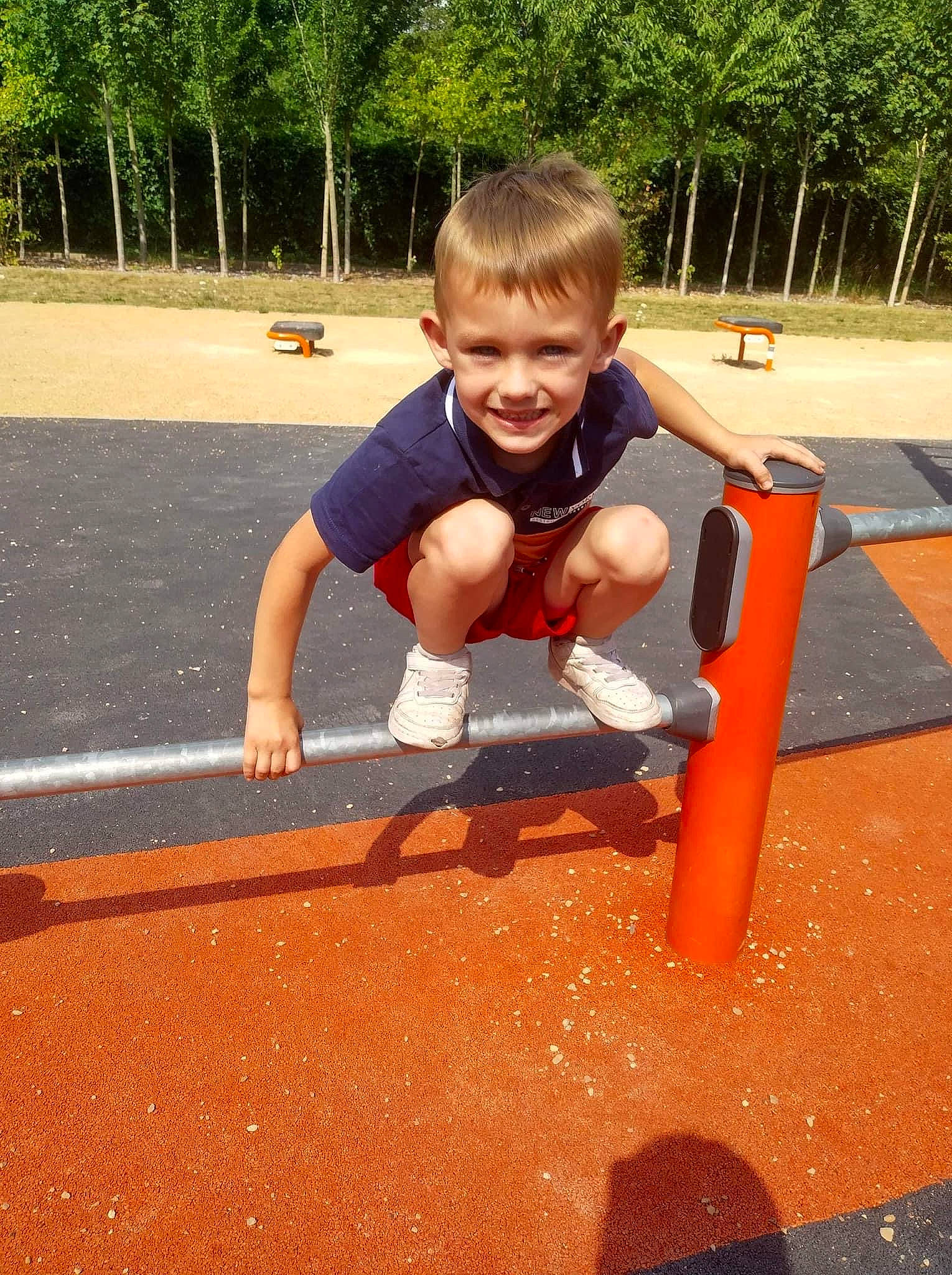 Kethan participe au concours pour gagner de l'argent avec cette photo : asphalt, child, chute, city, fun, grass, joy, leisure, outdoor_play_equipment, person, plant, play, playground, playground_slide, recreation, shorts, sitting, smile, soil, t_shirt