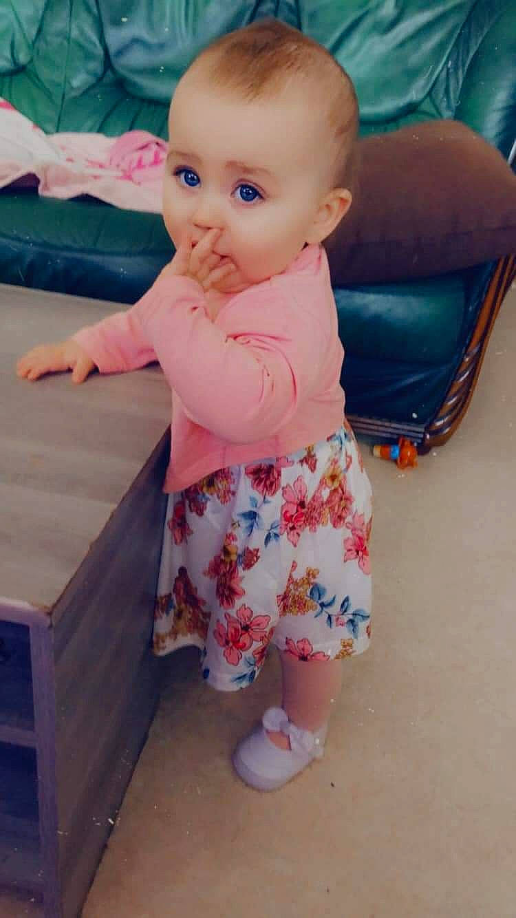 Mia participe au concours pour gagner de l'argent avec cette photo : baby, baby_products, baby_toddler_clothing, cheek, child, finger, foot, fun, iris, joint, pattern, person, pink, product, sitting, skin, sleeve, sock, t_shirt, thumb