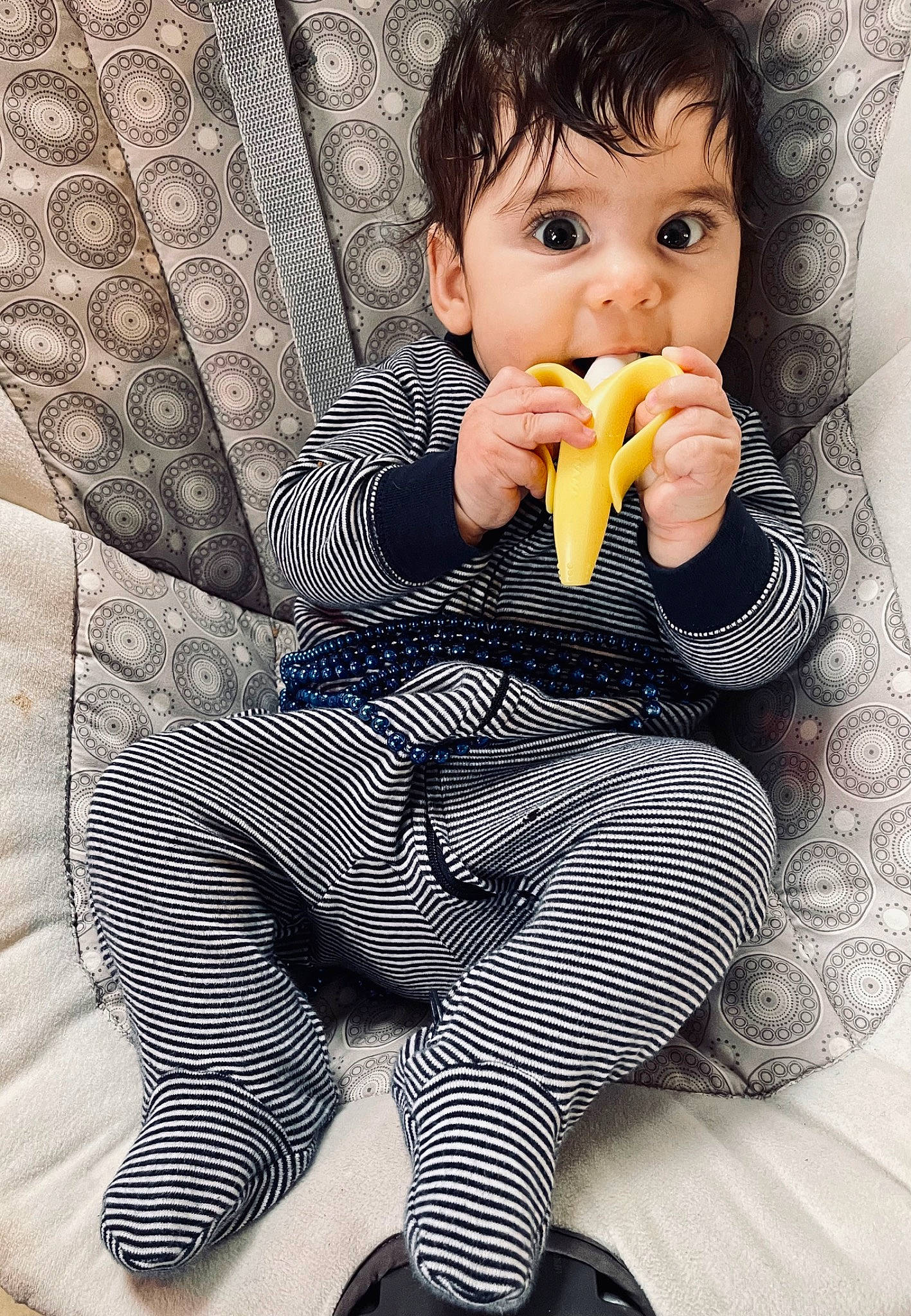 Zula is registered to the contest to win money with this photo: baby, baby_toddler_clothing, comfort, eye, face, facial_expression, finger, food_craving, gesture, head, human, knee, person, sitting, skin, sleeve, tableware, thigh, thumb, tie