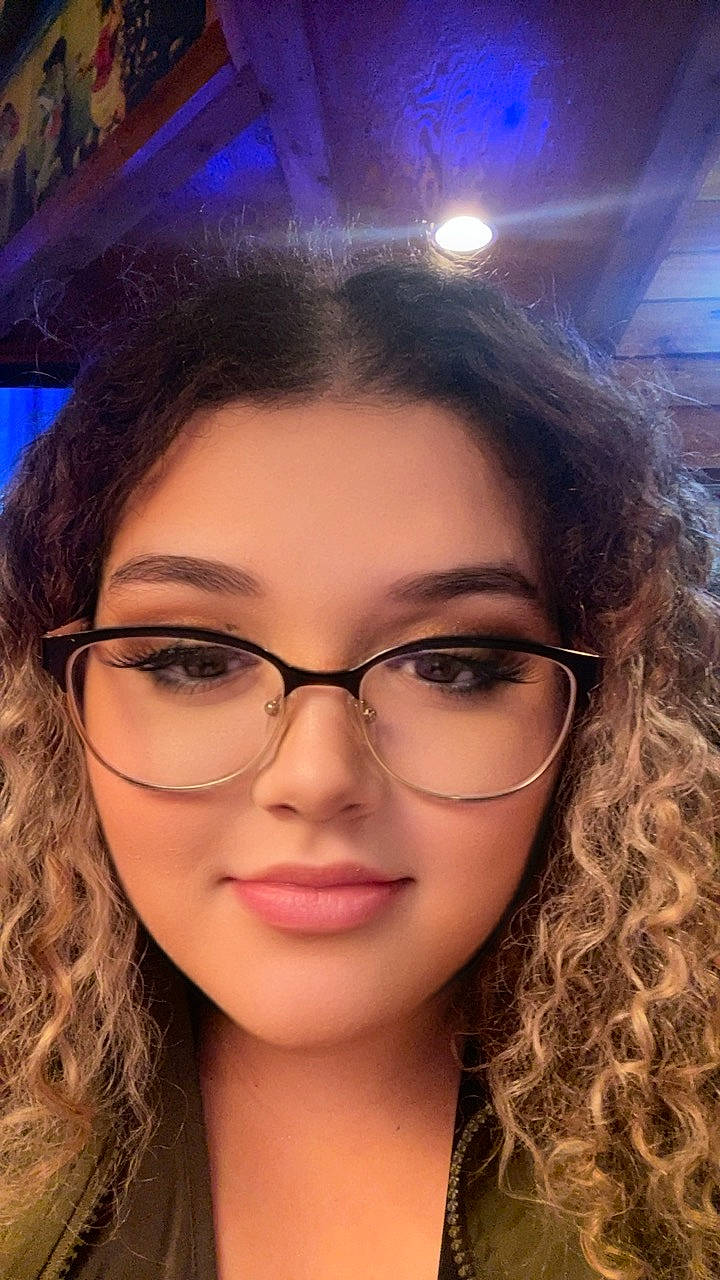 Amyrah is registered to the contest to win money with this photo: blue, cheek, chin, eyebrow, eyelash, eyewear, facial_expression, fashion, flash_photography, forehead, glasses, human, jaw, lip, nose, organ, person, photograph, purple, skin