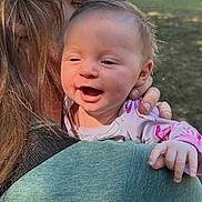 Eden joined the competition — help win amazing prizes! adult, baby, building, clothing, daylight, face, family, glasses, grass, hand, happy, hat, head, holding, kiss, nature, outdoor, person, portrait, smiling