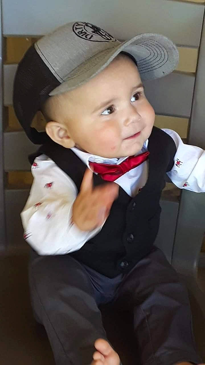 Charley is registered to the contest to win money with this photo: baby, baby_toddler_clothing, baseball_cap, bow_tie, cap, collar, dress_shirt, eye, eyebrow, face, fashion_accessory, formal_wear, happy, hat, headgear, headwear, person, sleeve, suit, tie