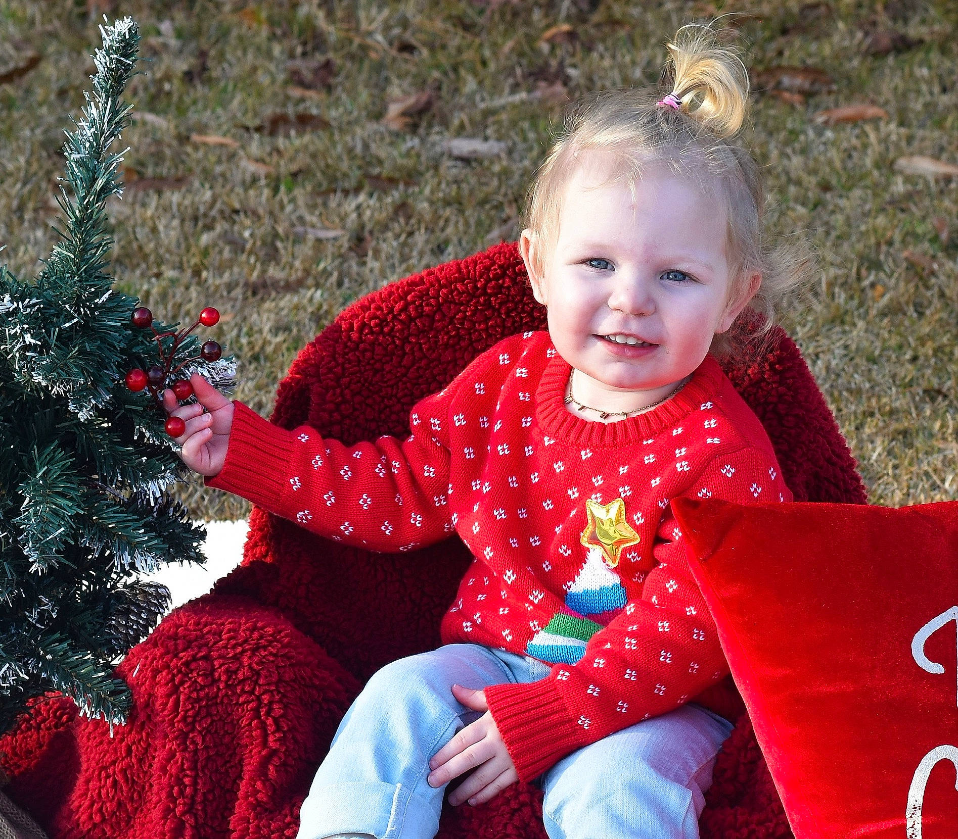 Harper joined the competition — help win amazing prizes! baby_toddler_clothing, child, design, event, eye, facial_expression, fun, grass, happy, head, joy, magenta, pattern, people_in_nature, person, photograph, pink, red, sitting, sleeve