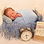 Saint joined the competition — help win amazing prizes! newborn, baby, sleeping, blue_blanket, white_bed, fluffy_bedding, alarm_clock, wooden_calendar, date, time, peaceful, indoors, portrait, infant, cute, rest, soft_texture, floor, baby_bed, wrapped