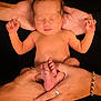Saint joined the competition — help win amazing prizes! newborn, baby, infant, hands, feet, skin, portrait, black_background, peaceful, sleeping, adult_hands, ring, bracelet, closeup, human, fingers, toes, body, care, love