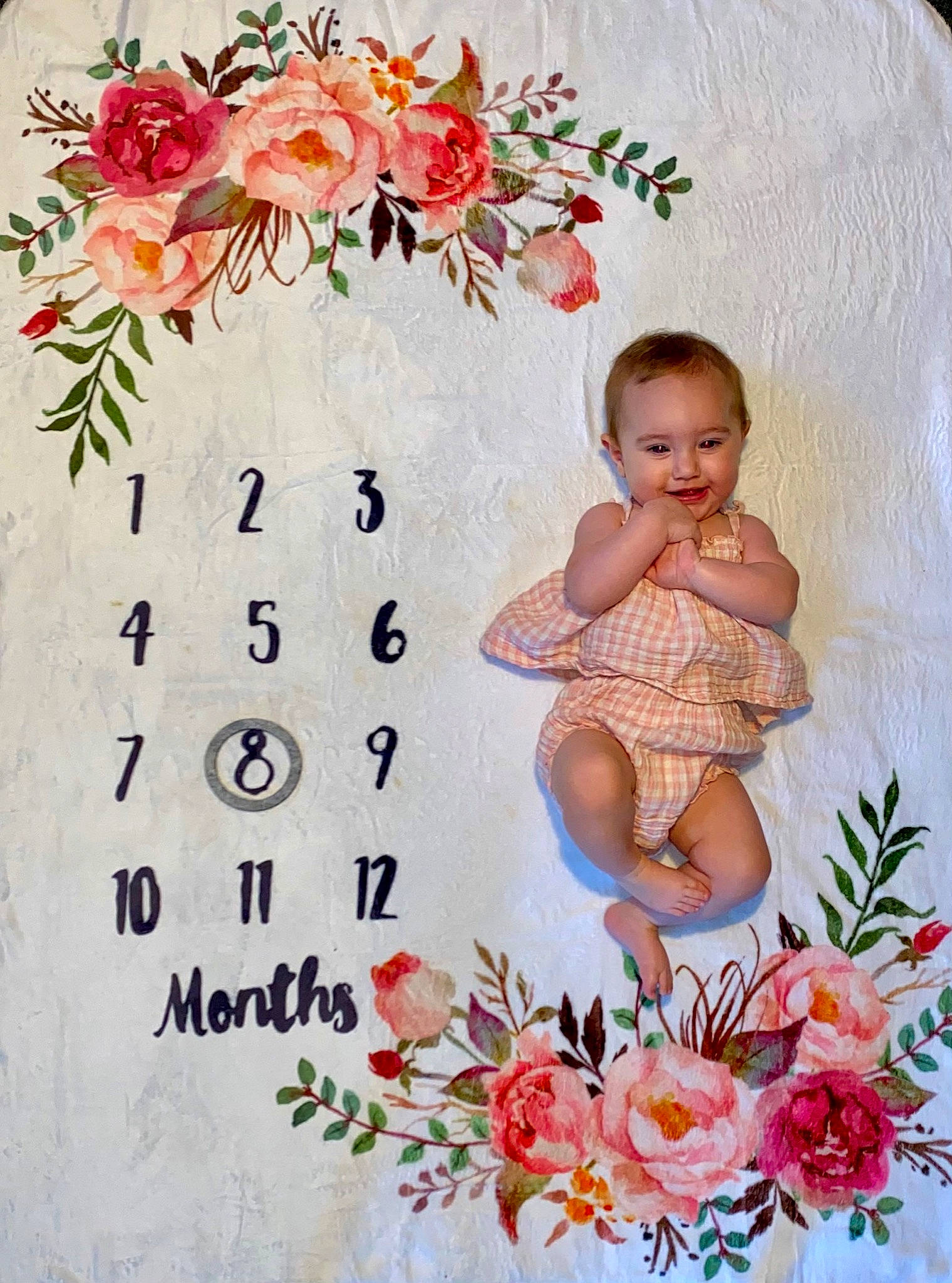 Lennon is registered to the contest to win money with this photo: baby, baby_toddler_clothing, beauty, botany, floral_design, flower, flower_arranging, font, happy, joy, leaf, orange, pattern, peach, person, petal, pink, plant, product, rose