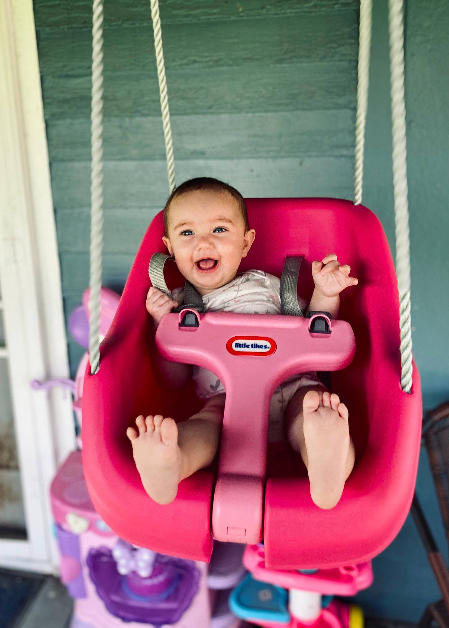 Lennon joined the competition — help win amazing prizes! baby, baby_carriage, baby_toddler_clothing, comfort, facial_expression, fun, hand, happy, head, human_body, jacket, leisure, magenta, person, pink, product, purple, recreation, skin, smile