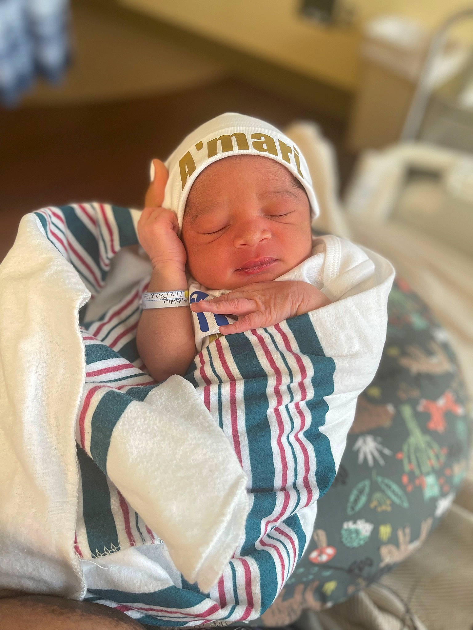 Amari is registered to the contest to win money with this photo: baby, baby_products, baby_sleeping, baby_toddler_clothing, cap, carmine, cheek, child, comfort, face, fashion_accessory, headgear, headwear, linens, person, room, sitting, skin, sleep, toddler