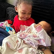 Nyomi joined the competition — help win amazing prizes! baby, blanket, child, clothing, couch, cozy, cute, family, furniture, happy, indoor, infant, love, onesie, person, polka_dot, portrait, sibling, smiling, toddler