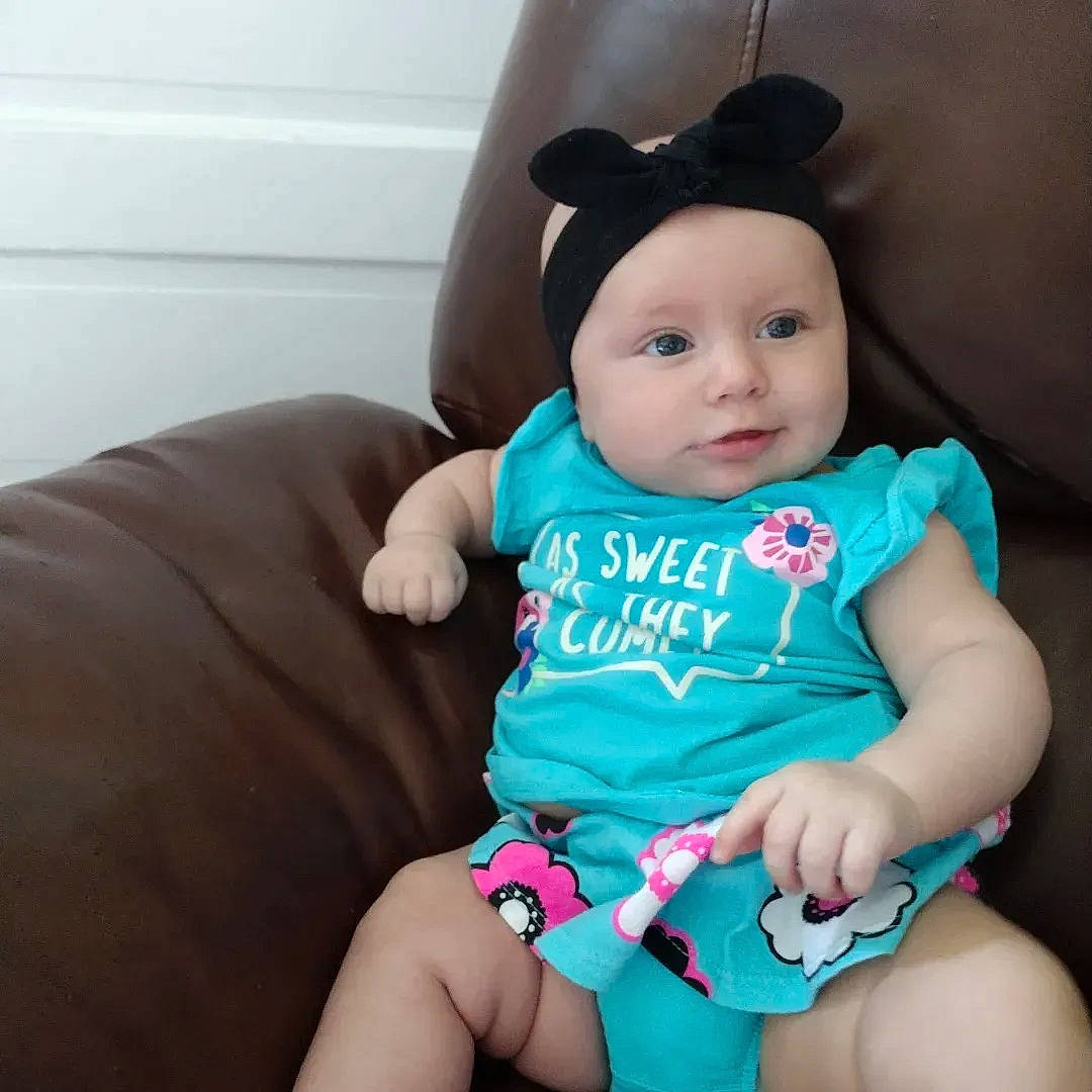 Lillie is registered to the contest to win money with this photo: baby, baby_toddler_clothing, cheek, comfort, cool, costume_hat, electric_blue, eye, face, finger, happy, head, headwear, human_body, neck, person, pink, skin, sleeve, t_shirt