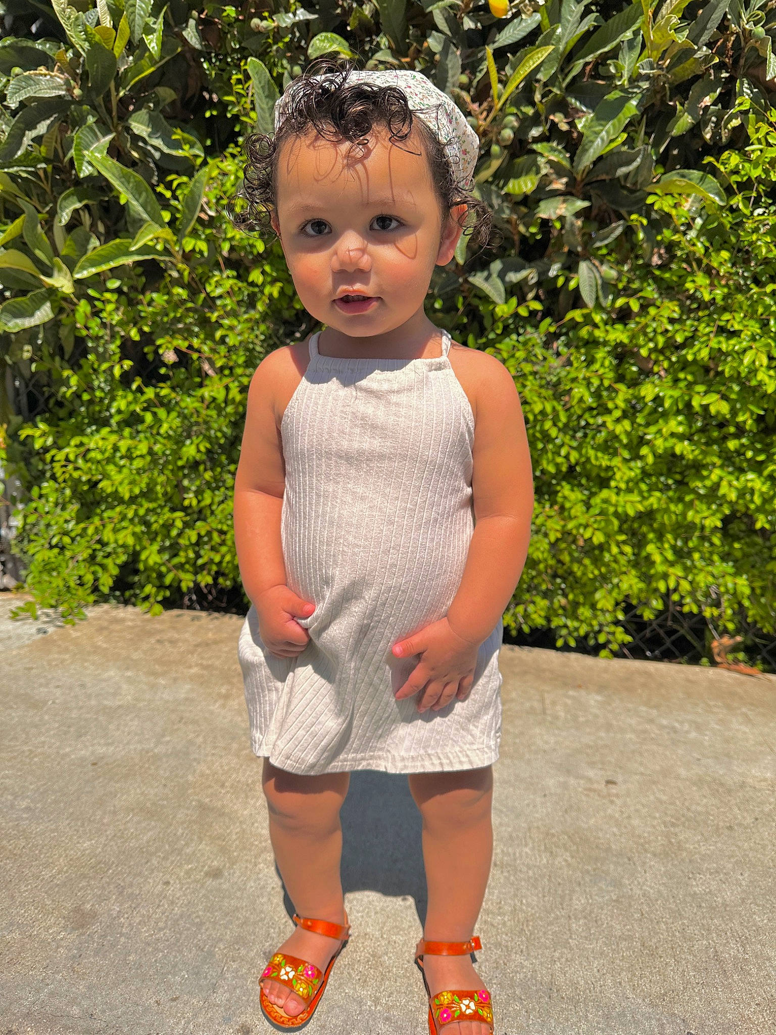 Zaniyah is registered to the contest to win money with this photo: baby_toddler_clothing, child, day_dress, fun, garden, grass, hair, happy, head, human_leg, knee, leisure, pattern, person, plant, shoulder, sleeve, t_shirt, toddler, vacation