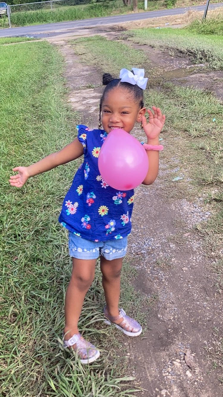 Jleigh is registered to the contest to win money with this photo: balloon, electric_blue, event, fun, grass, grassland, happy, head, joy, leg, leisure, magenta, party_supply, pattern, people_in_nature, person, pink, recreation, sandal, soil
