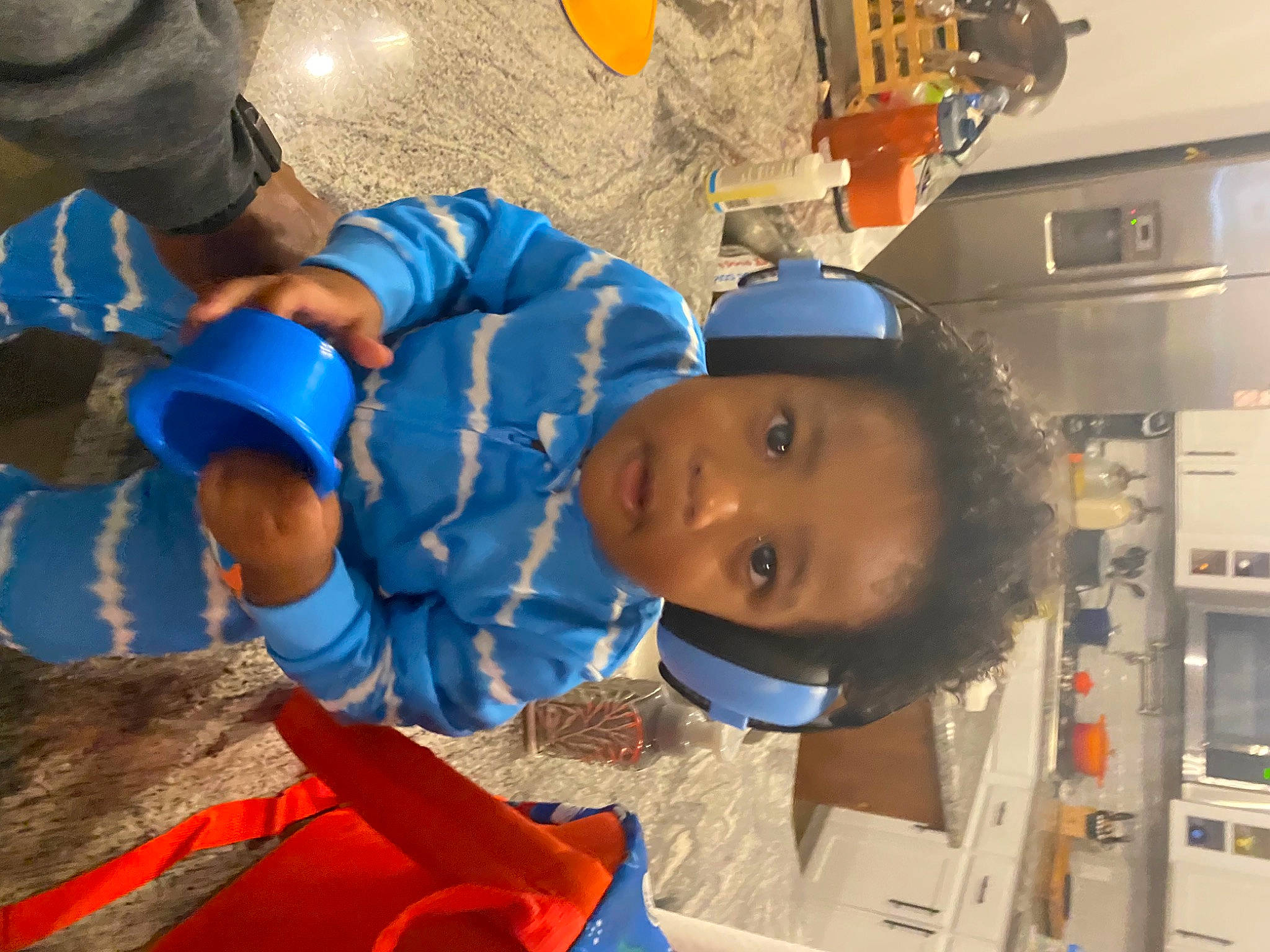 Drelyn is registered to the contest to win money with this photo: aerospace_engineering, baseball_cap, blue_collar_worker, child, clothing, electric_blue, engineering, fun, hat, leisure, machine, mouth, person, personal_protective_equipment, plastic, room, service, smile, soil, t_shirt