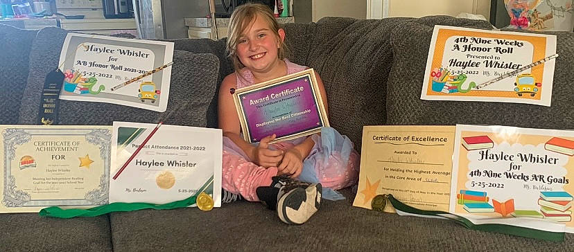 Haylee joined the competition — help win amazing prizes! child, couch, education, electronic_device, event, gadget, job, joy, learning, mammal, office_supplies, person, picture_frame, printer_tray, product, publication, reading, room, smile, table