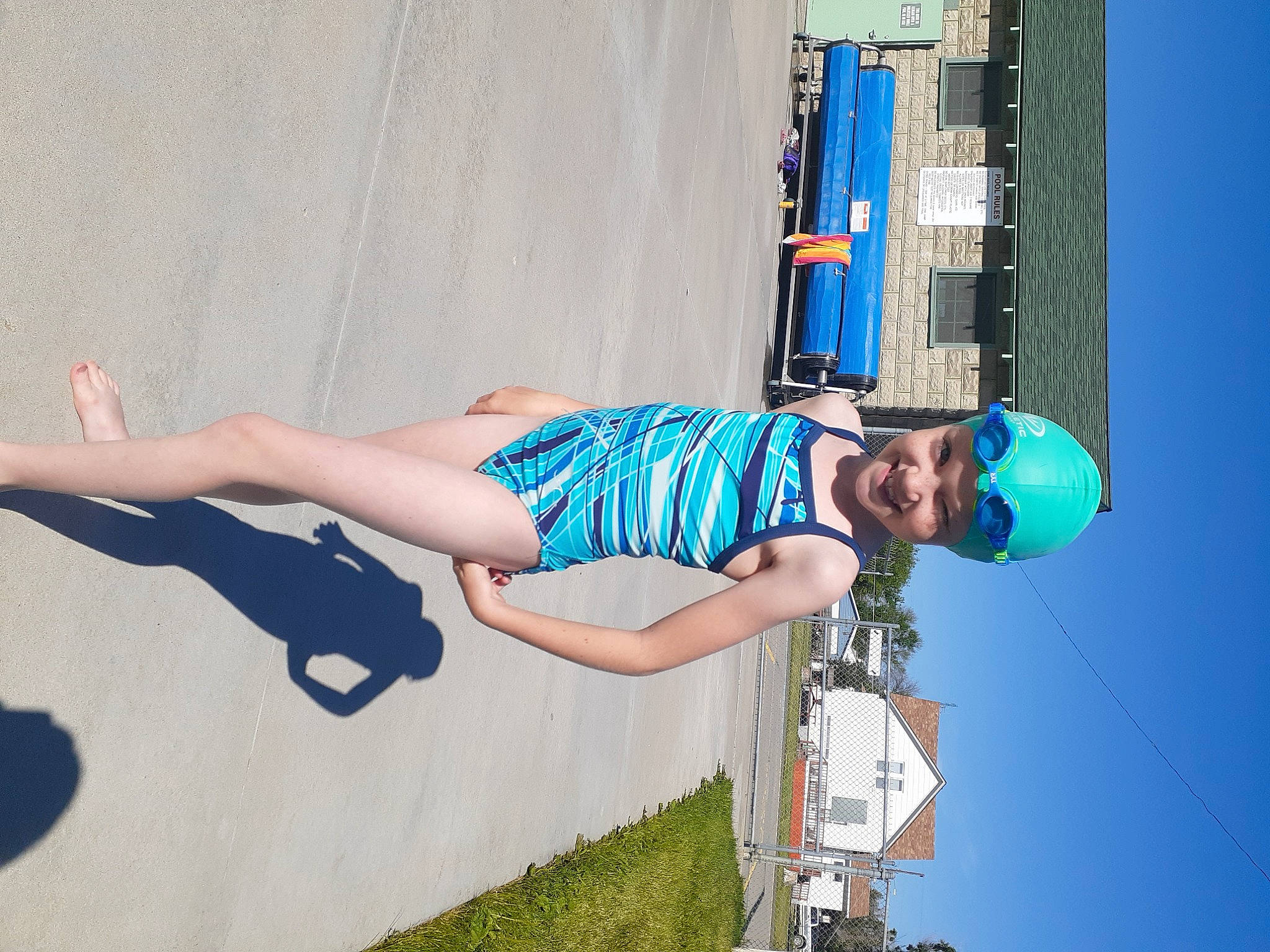 Annabella is registered to the contest to win money with this photo: arm, azure, blue, dress, elbow, electric_blue, eyewear, headwear, human_leg, joy, knee, leg, leisure, line, person, photograph, plant, sky, smile, thigh
