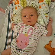 Mariah joined the competition — help win amazing prizes! baby, infant, onesie, pink, rabbit, striped_clothing, pillow, woodland_animals, deer, fox, bird, blanket, plush_toy, cute, child, face, expression, lying_down, bed, soft