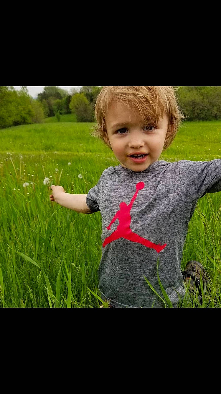 Rick is registered to the contest to win money with this photo: cheek, child, eye, fun, grass, grass_family, grassland, green, happy, lawn, meadow, people_in_nature, person, plant, play, portrait, skin, smile, spring, toddler