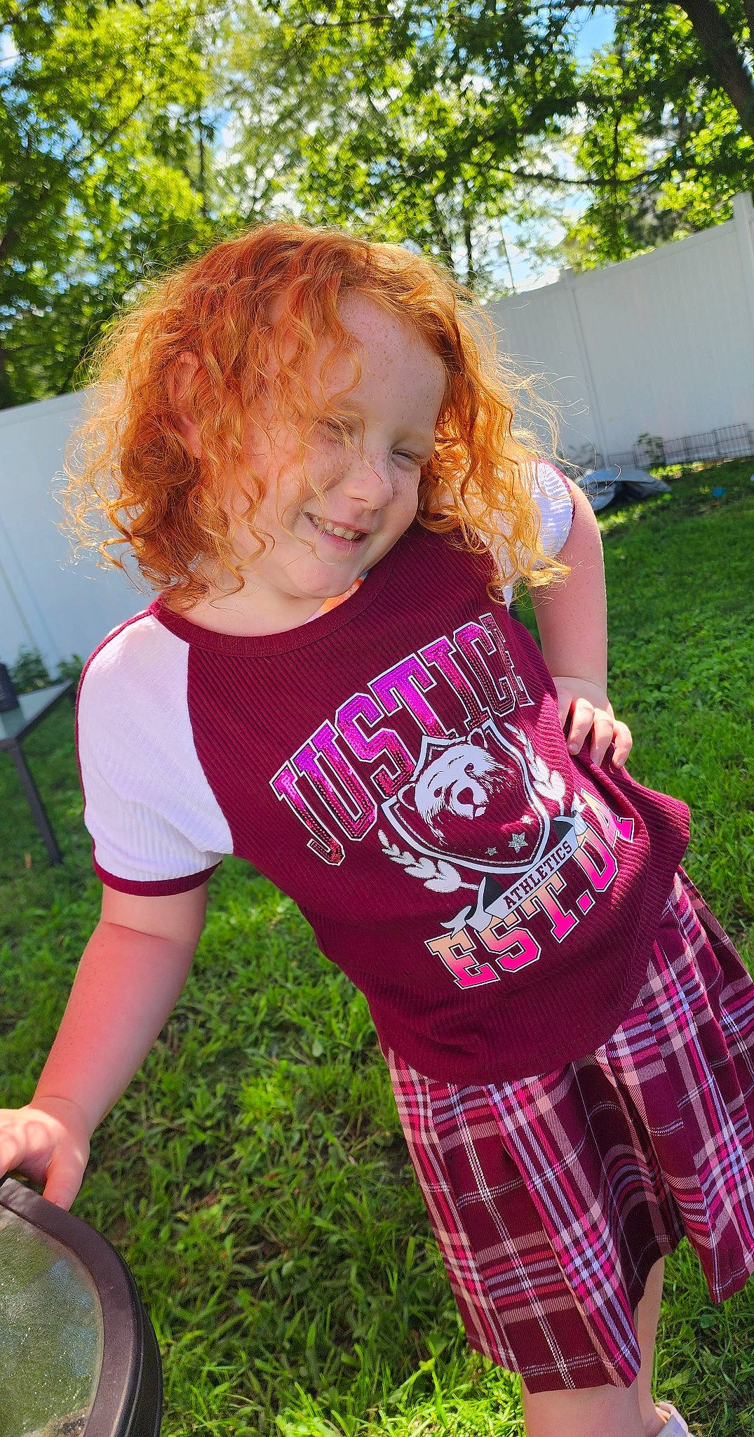 Delanie joined the competition — help win amazing prizes! cool, fun, grass, hair, happy, joy, lawn, leisure, magenta, people_in_nature, person, pink, plaid, plant, sleeve, smile, summer, t_shirt, tartan, toddler