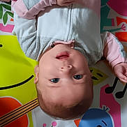 Marie is registered to the contest to win money with this photo: applique, baby, bodypart, bonnet, cap, clothing, crib, face, finger, furniture, glove, hand, hat, head, newborn, pattern, person, photography, portrait, toy