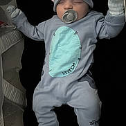 Archie joined the competition — help win amazing prizes! baby, sleeping, pacifier, hat, onesie, socks, playpen, blanket, child, cute, soft_lighting, indoor, peaceful, stitch_theme, glove, infant, resting, clothing, adorable, nursery