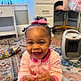 Ariel joined the competition — help win amazing prizes! baby, bow, carpet, child, curly_hair, cute, face, floor, furniture, hand, happy, heater, home, indoor, person, pink_pajamas, portrait, rug, shoes, smiling
