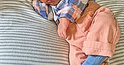 Ka'Mari joined the competition — help win amazing prizes! newborn, baby, sleeping, plaid_shirt, peach_pants, blue_socks, striped_blanket, cozy, indoors, cute, infant, resting, peaceful, person, child, portrait, soft_lighting, wooden_floor, casual_clothing, relaxation