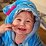 Charly participe au concours pour gagner de l'argent avec cette photo : toddler, child, smiling, blue_costume, hood, indoor, cute, happy, face, baby, plush, eyes, ears, hand, cheek, portrait, warm_lighting, clothing, expression, fun