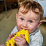 baby, child, blue_eyes, chewing, dinosaur_toy, indoor, cute, hands, short_sleeves, plush_toy, teething, light_brown_hair, portrait, smiling, toddler, toy, white_shirt, young_child, closeup, happy