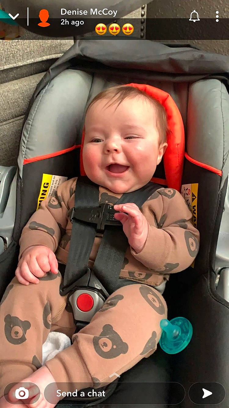 Elijah is registered to the contest to win money with this photo: automotive_design, baby, baby_toddler_clothing, car_seat, cheek, child, comfort, facial_expression, finger, happy, mammal, mouth, nose, organ, people, person, product, skin, smile, thumb