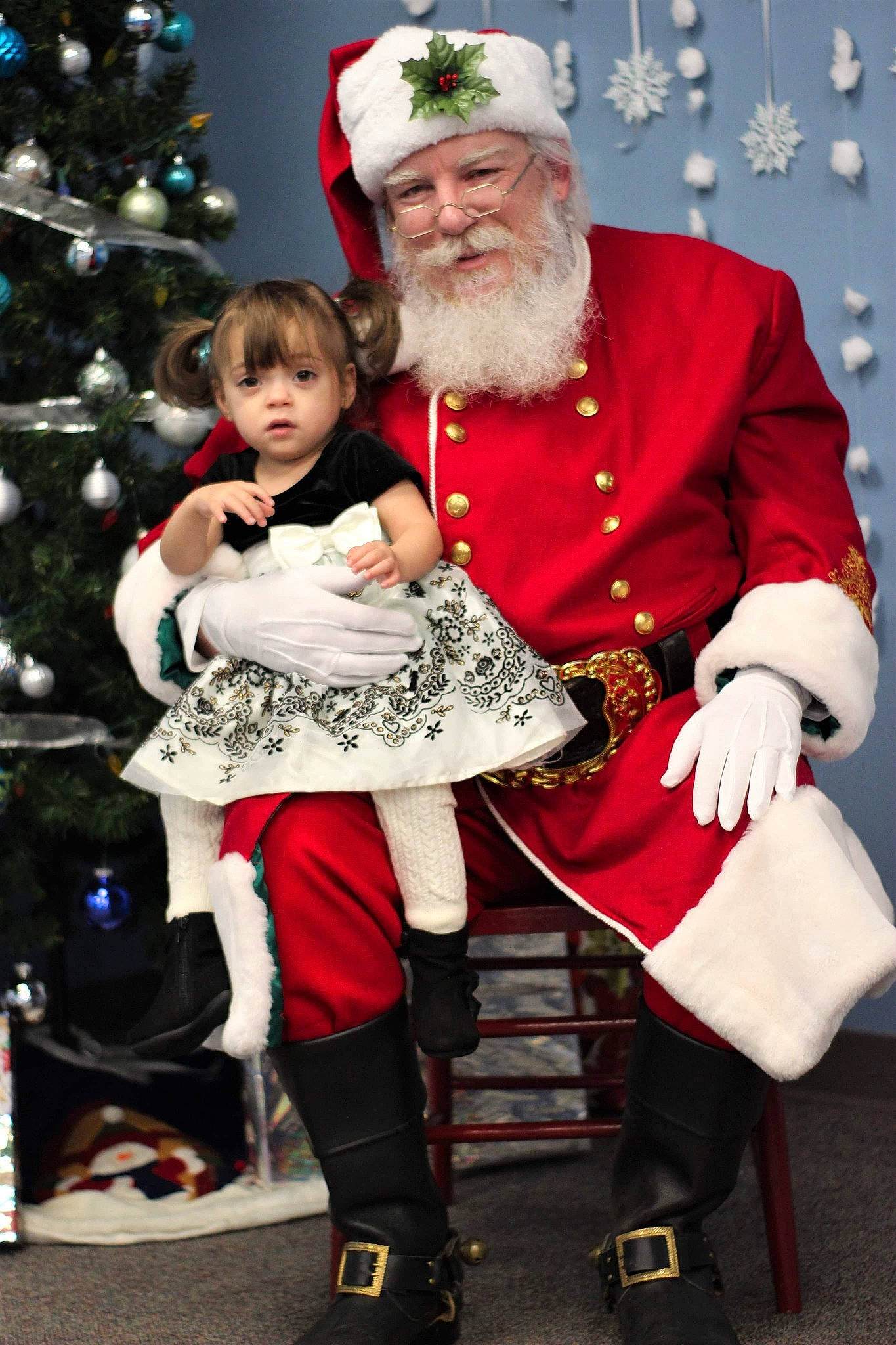 Anastasia is registered to the contest to win money with this photo: beard, child, christmas, christmas_decoration, christmas_eve, christmas_ornament, christmas_tree, costume, event, facial_hair, fictional_character, headwear, holiday, human_body, lap, person, santa_claus, toddler, tradition