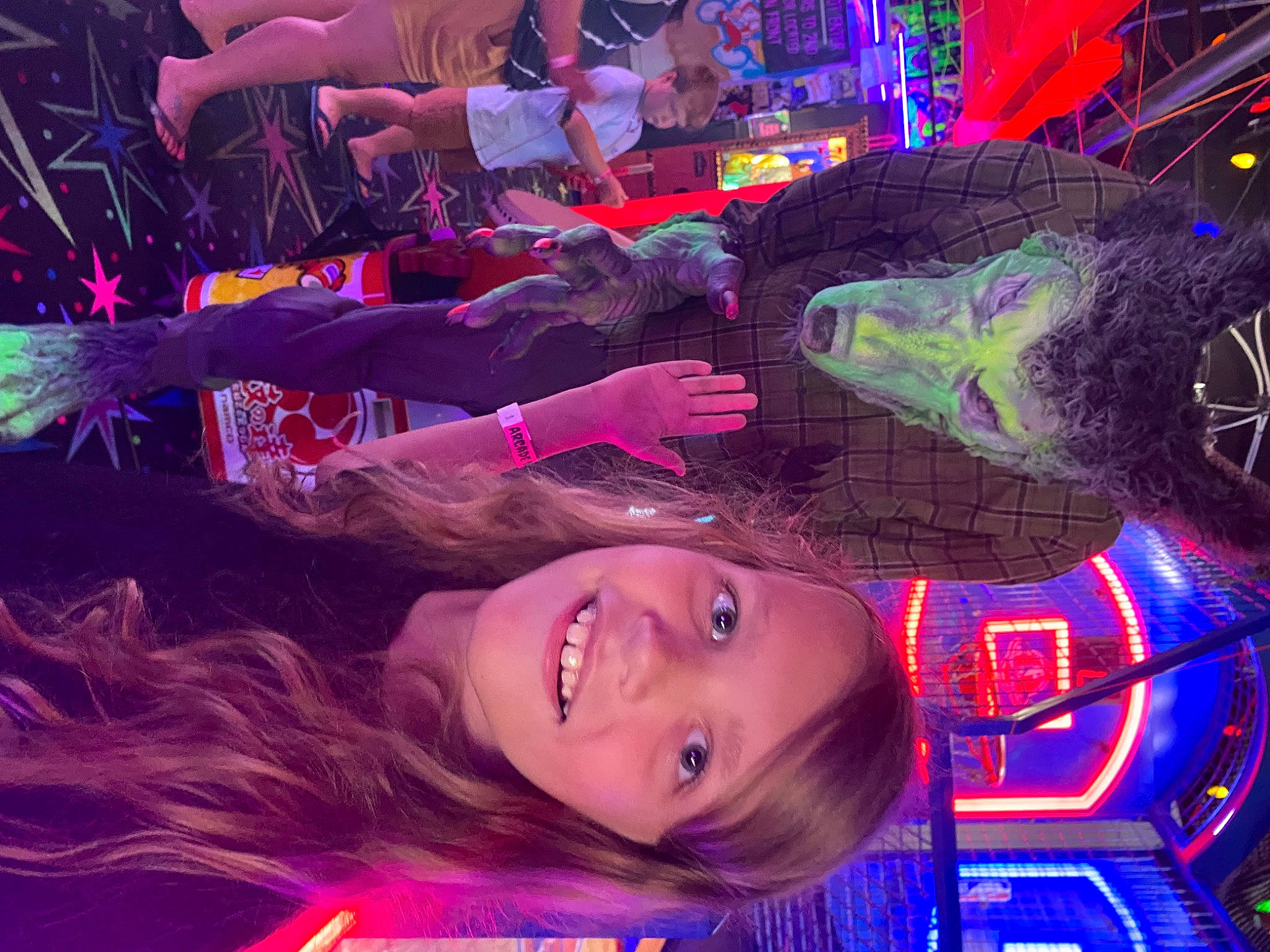 Riley is registered to the contest to win money with this photo: electric_blue, entertainment, event, fun, joy, leisure, light, magenta, music_venue, neon, night, party, performance, person, pink, purple, smile, snapshot, space, tree