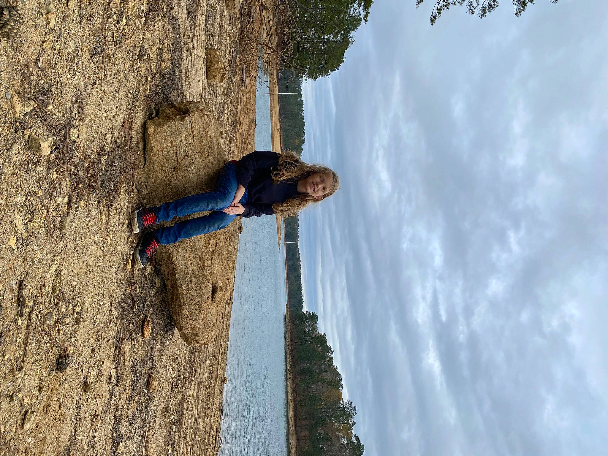 Riley is registered to the contest to win money with this photo: adventure, cloud, electric_blue, formation, fun, geological_phenomenon, joy, landscape, leisure, person, plant, recreation, rock, shadow, sky, slope, soil, tree, trunk, vacation