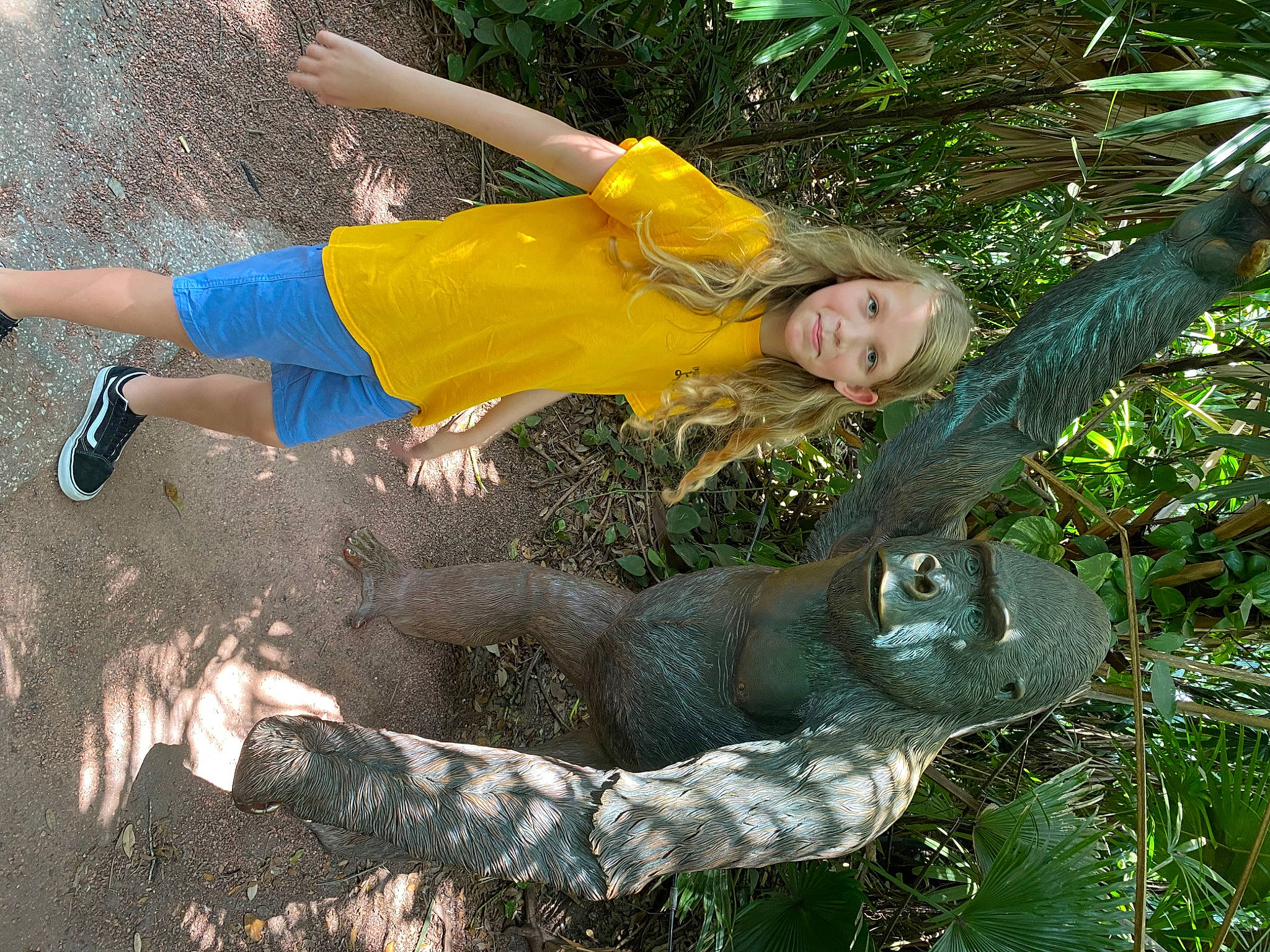 Riley joined the competition — help win amazing prizes! electric_blue, fun, gesture, grass, happy, human_leg, leisure, people_in_nature, person, plant, smile, soil, thigh, tree, trunk, wood