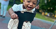Kaiomi joined the competition — help win amazing prizes! baby, caregiver, child, daylight, face, happy, infant, motion, outdoor, park, person, playground, playground_equipment, portrait, sitting, smiling, summer, swing, toddler, trees